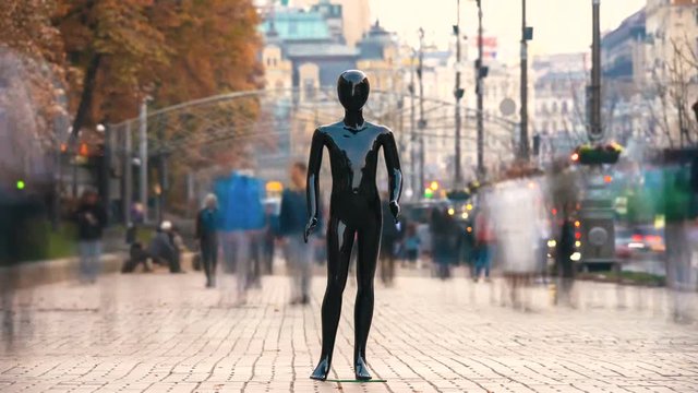 The black mannequin standing in a people crowd outdoor. time lapse
