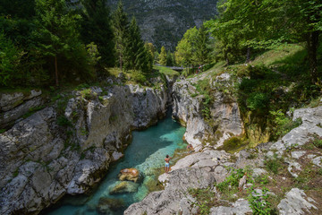 Fototapeta na wymiar Just above Lepena Valley close to Bovec the Soča (Isonzo) River has carved 750 meters long gorge named Velika Korita. The gorge is completely narrow at some points up to 15 m deep.