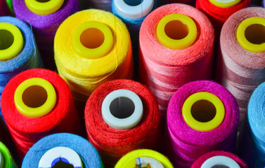 Sewing threads as a multicolored background closeup