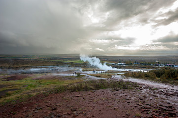 Strokkur (churn) fountain geyser in the geothermal area beside the Hvítá River. Haukadalur, Geysir - Iceland