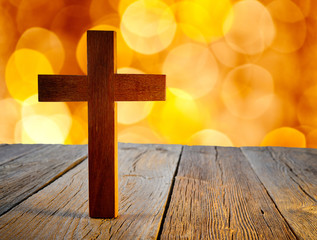 Christian wood cross on blur flare lights