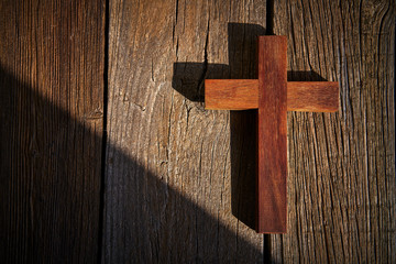 Christian cross on wood over wooden