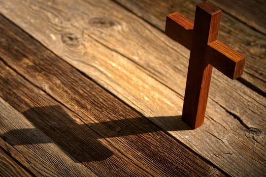 Christian cross on wood over wooden
