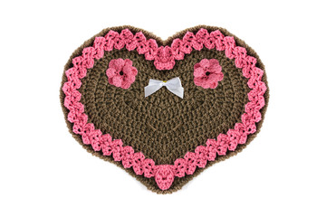 crochet Gingerbread heart shape valentines day gift with copy space on white isolated background