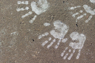 Print on the road. Chilfdren hands. Copy space