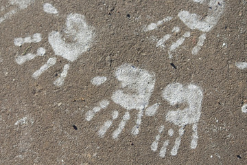 Print on the road. Chilfdren hands. Copy space