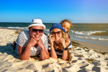 the family is resting on the beach