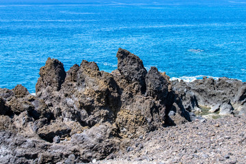 Fototapeta na wymiar Rock formations at the edge of the lava field at Playa de Los Guirres, La Palma, Canary Islands, Spain