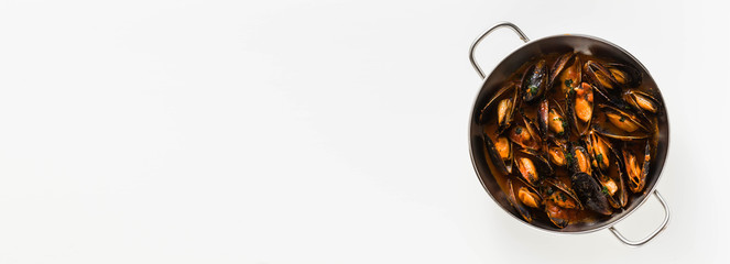 banner of freshly cooked mussels in a frying pan in tomato sauce. pepata di cozze or mussels marinara. classic dish of mediterranean italian cuisine . isolated on white