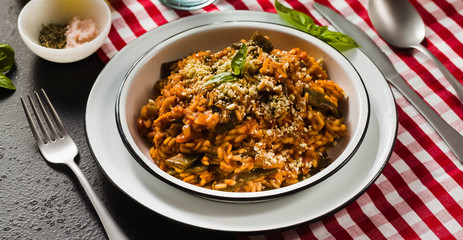 banner of Italian risotto with tomato sauce on the table.