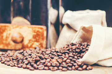 coffee beans on wooden background, arabica coffee, vintage filter image
