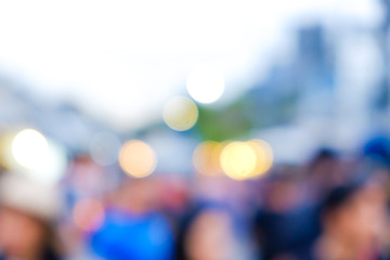 Abstract blurred people walking on market with light of bokeh