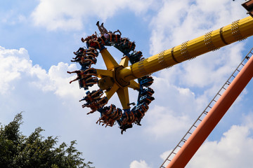 People are adventurous in amusement park.