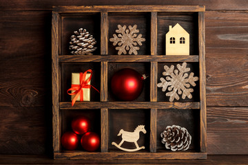 Christmas wooden box with red ornaments