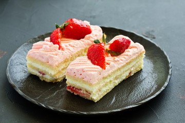 strawberry cake. dark background.