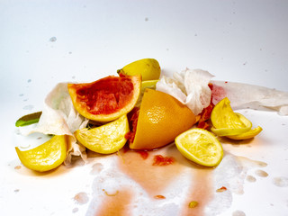 Fototapeta na wymiar squeezed lemon and a pile of garbage