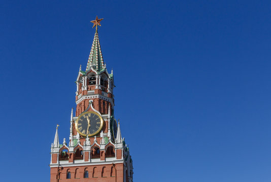 Spasskaya Tower of Moscow Kremlin against blue sky, Russia