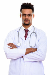 Fototapeta premium Studio shot of young African man doctor wearing eyeglasses with 