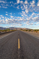 A long, straight road through the Californian desert, near Joshua Tree National Park