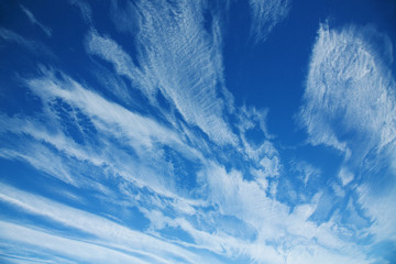 high cirrus clouds against the blue sky