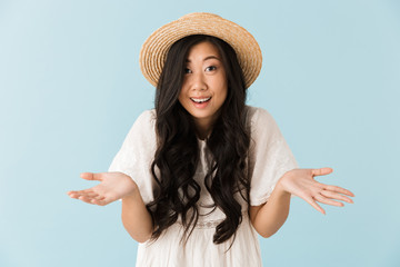 Emotional woman isolated over blue background.