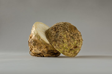 Halved Raw Celeriac on Gray Seamless Surface