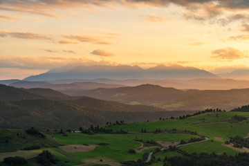 Obraz premium Beautiful sunset over high rocky peaks in High Tatras mountains on Slovak and Polish border.