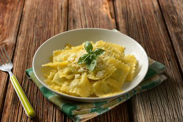 ravioli stuffed with spinach and ricotta with cheese and basil - italian food