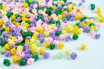 Colorful origami stars or flowers folding paper,on white background