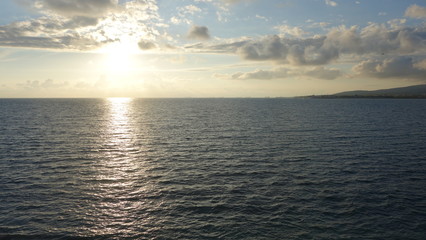 Sunset on sea. Reflection from the sun on water