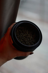 Chinese tea leafs in the metallic jar