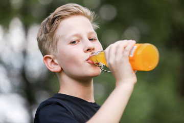 Boy in summer garden.