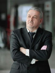 thoughtful businessman on background of office.photo with copy space