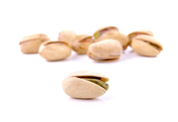 Pistachio nuts on a white background.