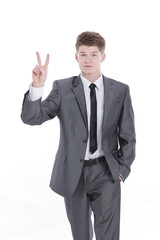 handsome businessman showing victory sign.isolated on a white background.