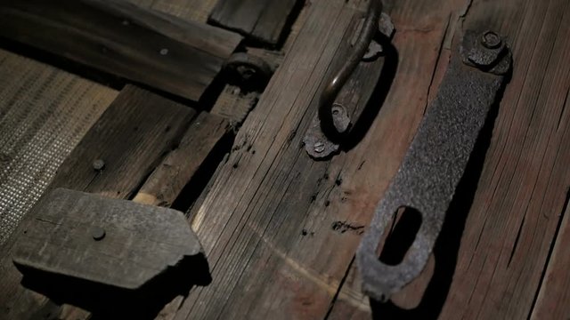 Wooden door to the old barn. Horror unknown behind the door.