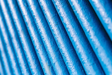 Many old blue pipes. Pipeline used in different industry ways: gas, water or vapor supply. Close up