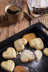 Heart shaped cookies with crumbs and coffee