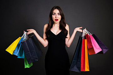 Black friday sale concept. Attractive young woman with long brunette hair, smiling, wearing sexy...