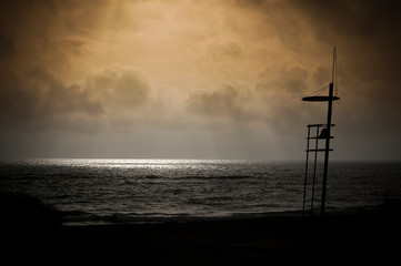 Lifeguard chair at sunrise