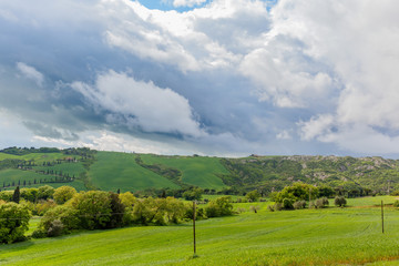 Beautiful rural landscape view in Tuscany with storm clouds