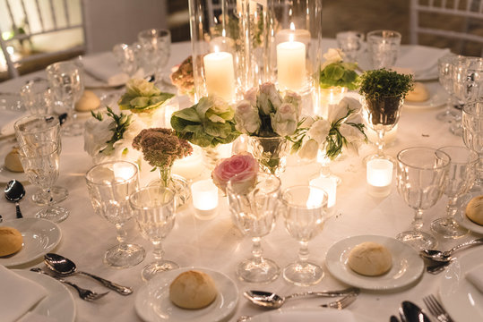 Decorated table for a wedding at night with candles