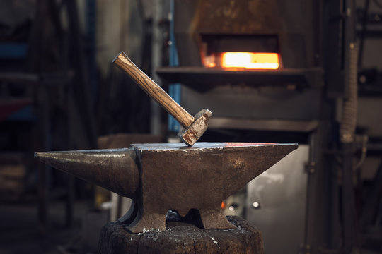 Mallet on an anvil in front of a furnace