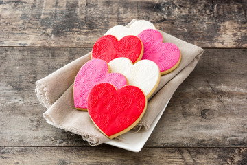 Heart-shaped cookies for Valentine's Day on wooden table

