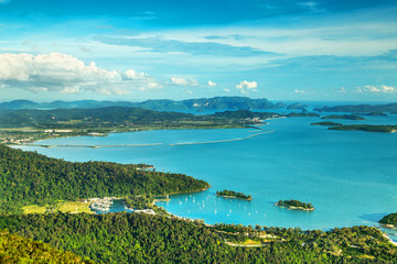 View of tropical island Langkawi and cable car in Malaysia, covered with tropical forests as seen from the sky bridge.  - obrazy, fototapety, plakaty