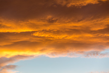 Fototapeta na wymiar Vibrant orange and yellow sunset sky