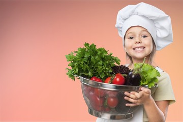 Portrait of adorable little girl preparing healthy food at