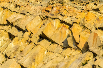 Wall of orange coloured limestone