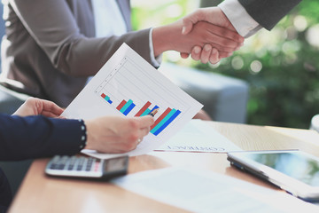 close up. businessman considers financial profit from the new deal