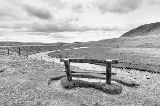 a bench next to a river